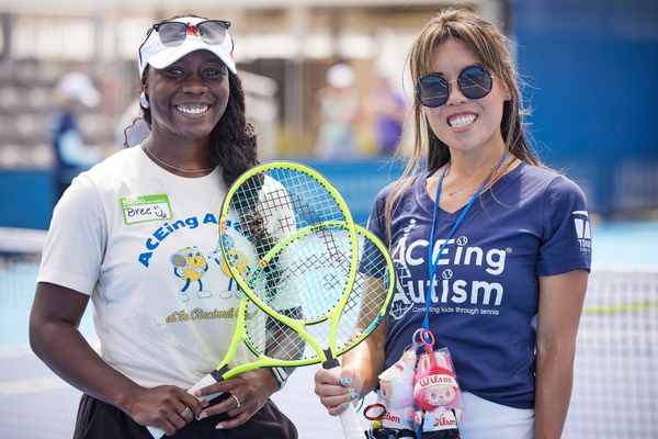 Two ACEing Autism program leaders smiling at the Cincinnati Open